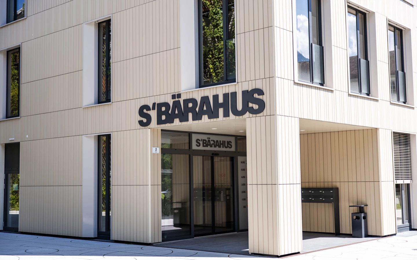 The Brauhaus building with its main entrance, showcasing modern architecture and clean lines (Baerahus, Feldkirch).